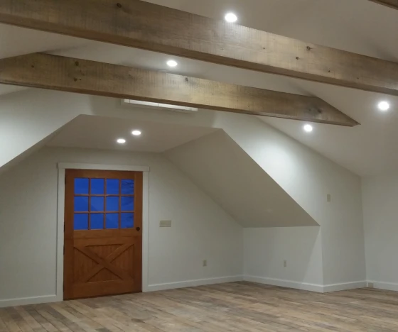 Interior Painting In Farmington 10 an empty room with a wooden door and a window.