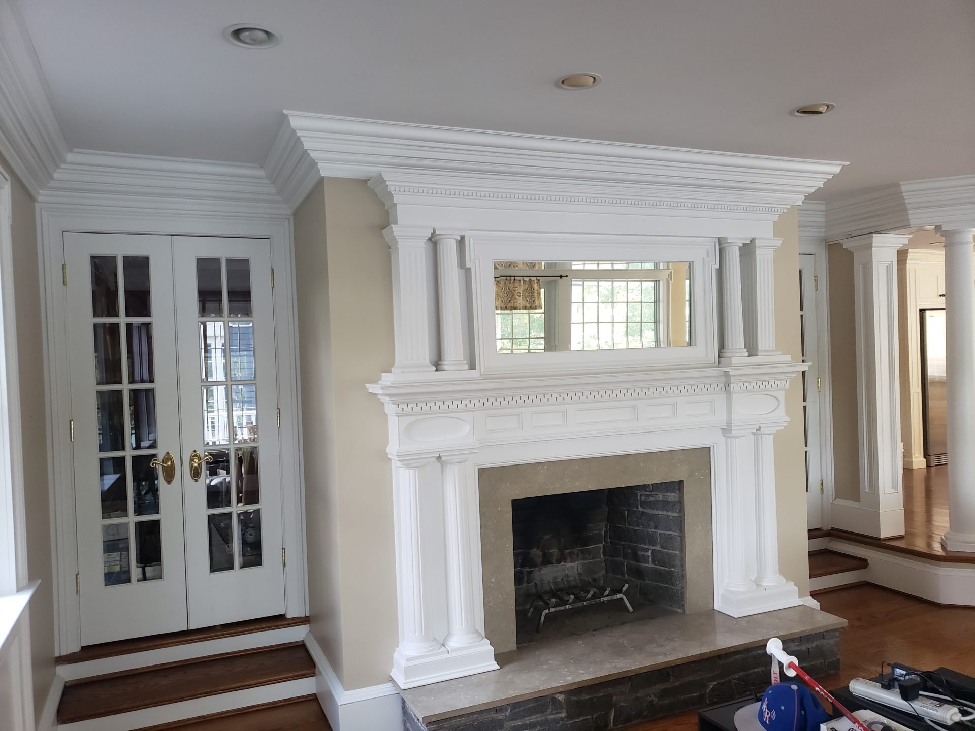 Interior Painting In Colchester 6 A living room with a fireplace and white trim.