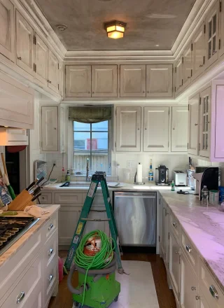 The Ultimate Guide to Kitchen Cabinet Painting in Marlborough, CT 4 A kitchen before kitchen cabinet painting done by Clean Cut Painting
