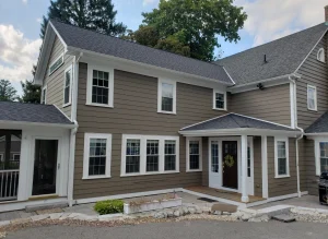 Blog 6 A home with gray siding and black trim.